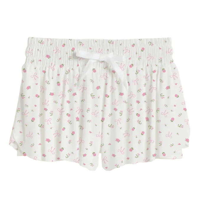 Floral patterned skirt with a white ribbon on a white background