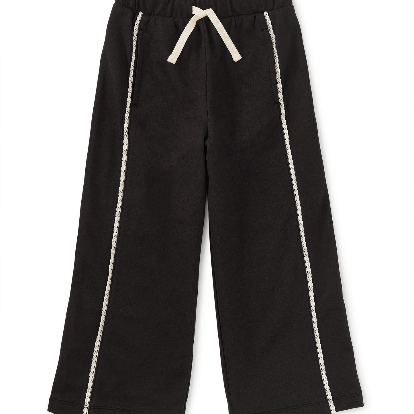 Black track pants with white lace trim on the legs and a drawstring waist.