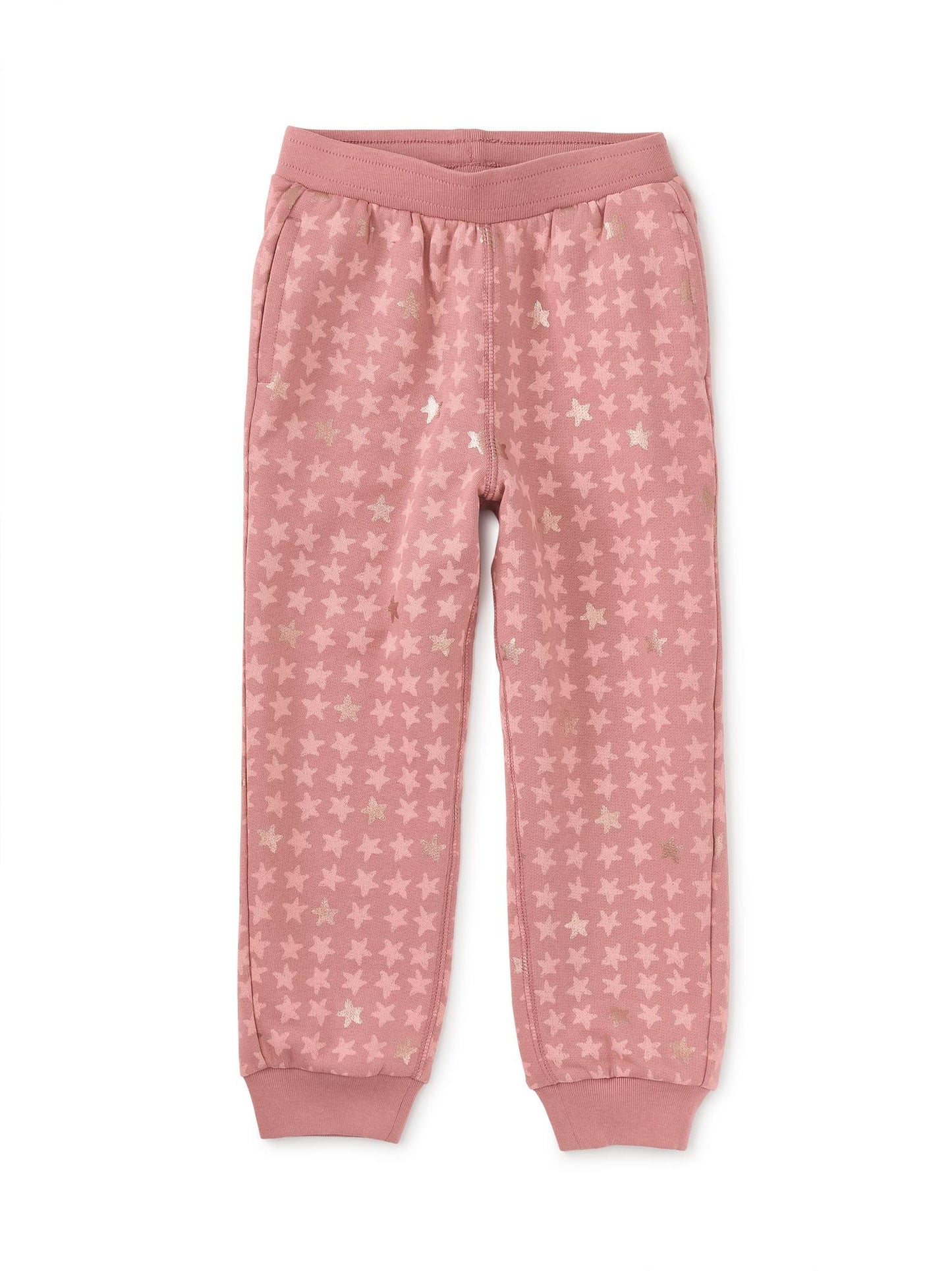 A pair of pink metallic stars joggers for girls, featuring an elastic waistband and fully functional interior drawcord.