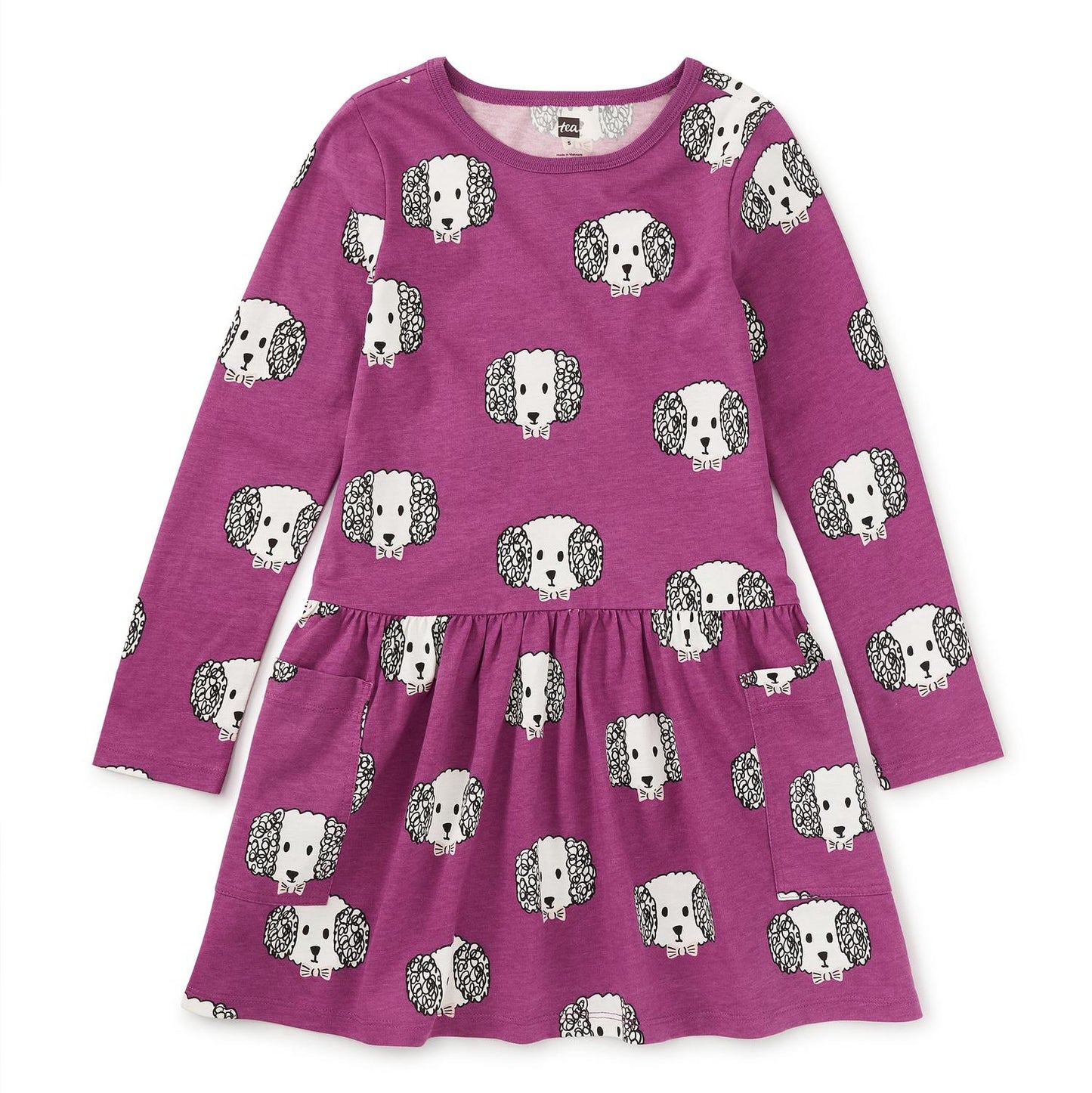 A long sleeve purple dress with a crew neckline and patch pockets, featuring a dog pattern.