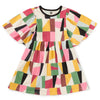 A multicolored geometric patterned dress with flutter sleeves and a round neckline.