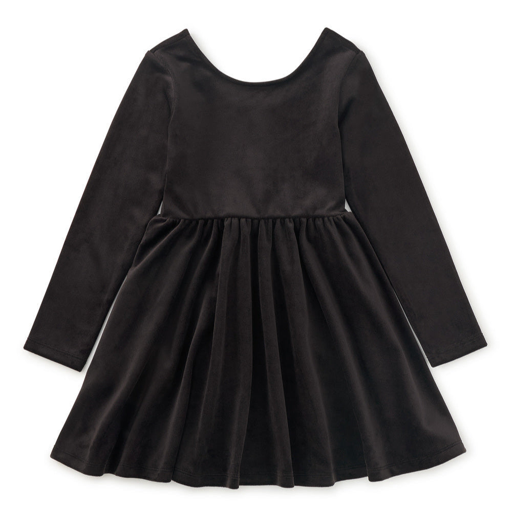 Black velour dress with long sleeves on a white background