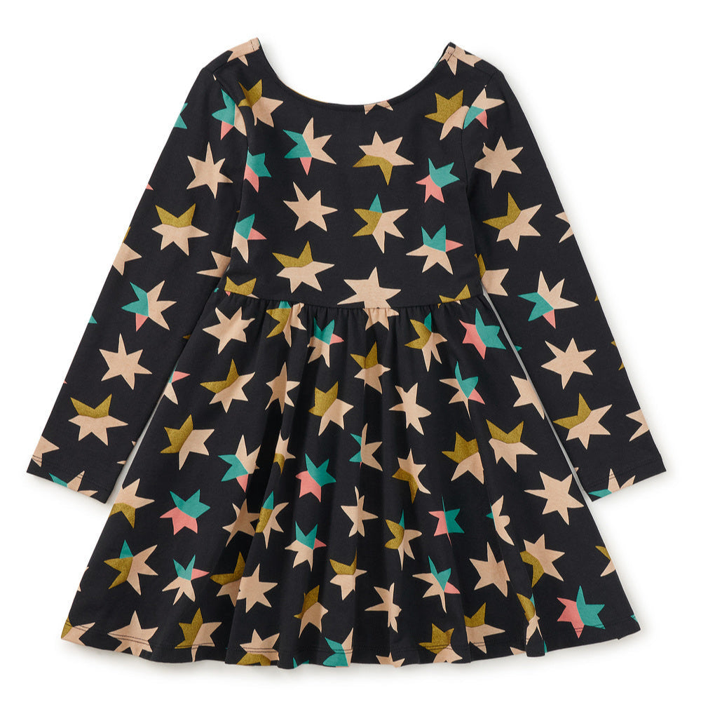 Black dress with colorful star pattern on a white background