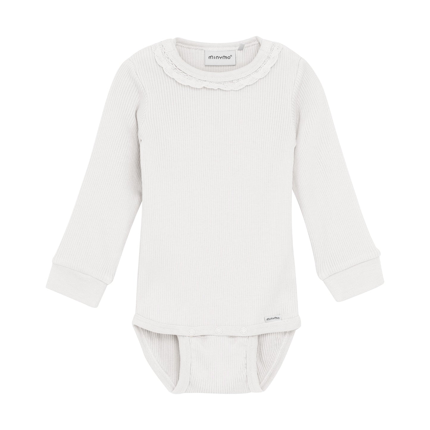 White baby outfit with long-sleeve top and pants on a white background