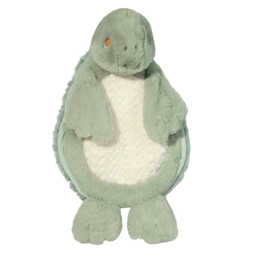 Plush toy dinosaur with a white belly on a light green background