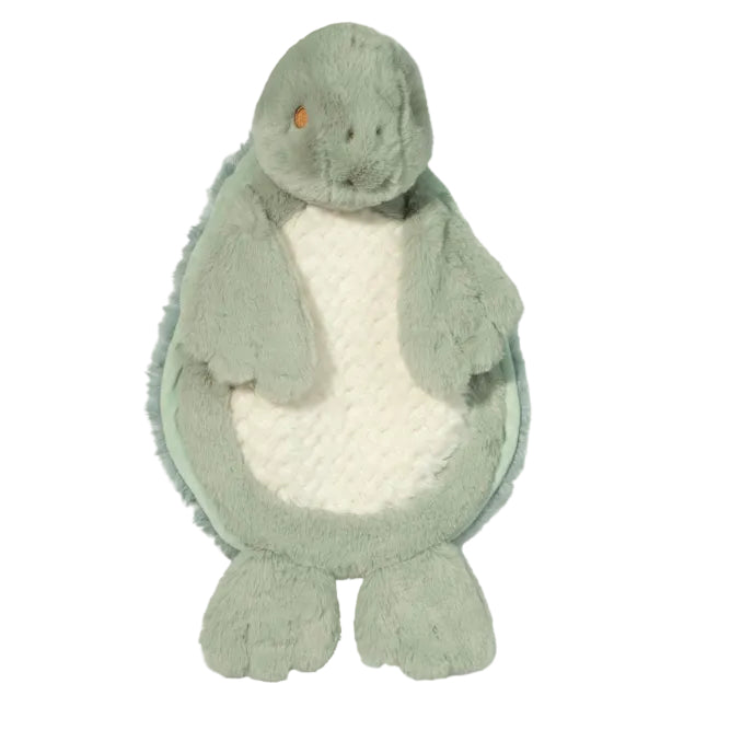 Plush toy dinosaur with a white belly on a light green background