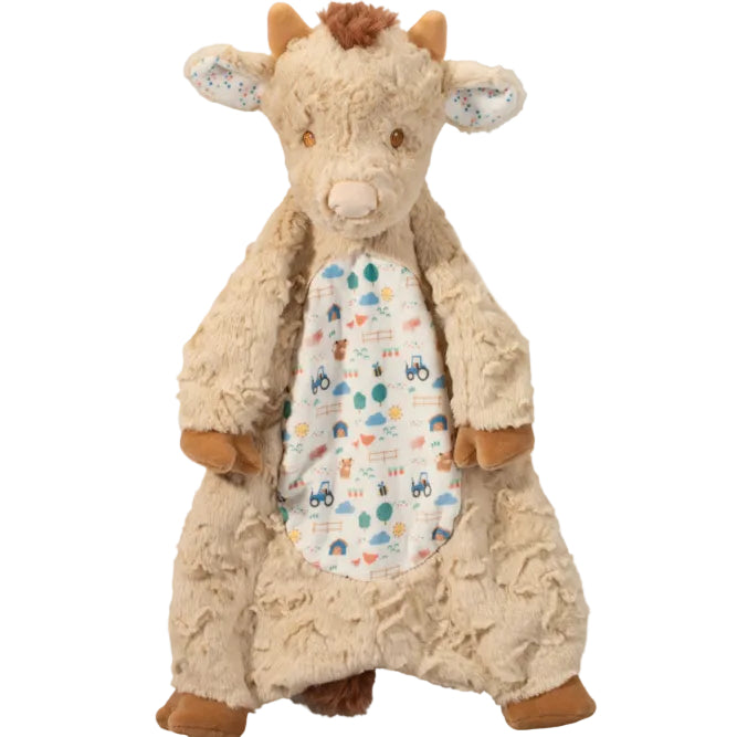 Plush toy cow with a patterned body on a white background