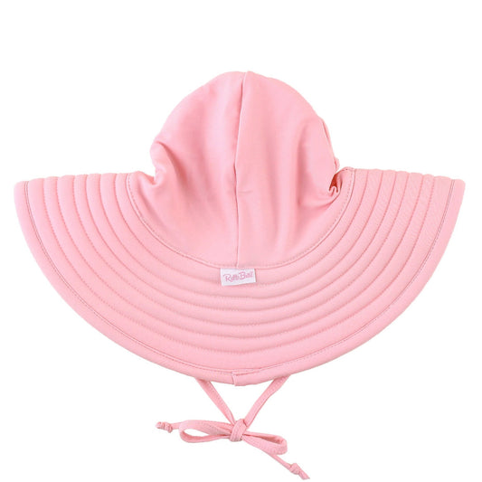 Pink sun hat with a tie on a white background