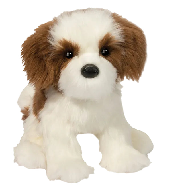 Plush toy dog with brown and white fur on a white background