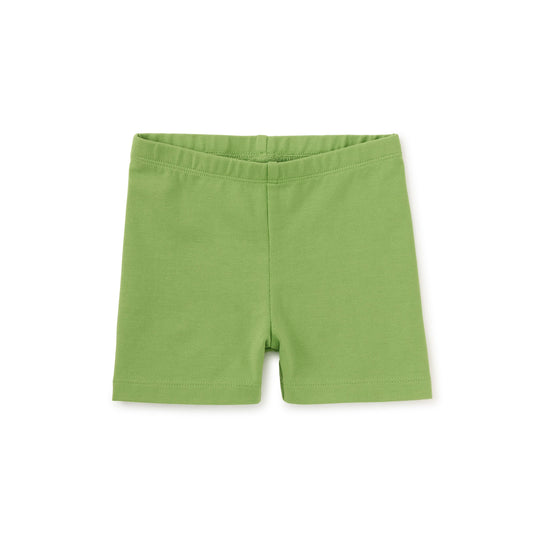 Green somersault shorts for kids, made of cotton, displayed against a white background