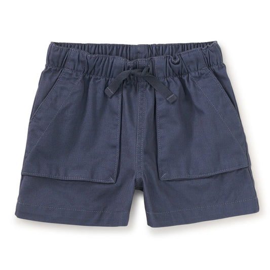 A pair of blue camp shorts for girls, with an elastic waistband and functional drawcord, made of 100% cotton twill.