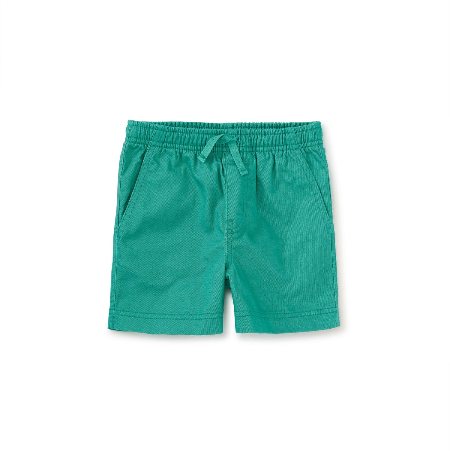 Mid-thigh length green sport shorts with an elastic waistband and drawcord, featuring slash front pockets and a back patch pocket.