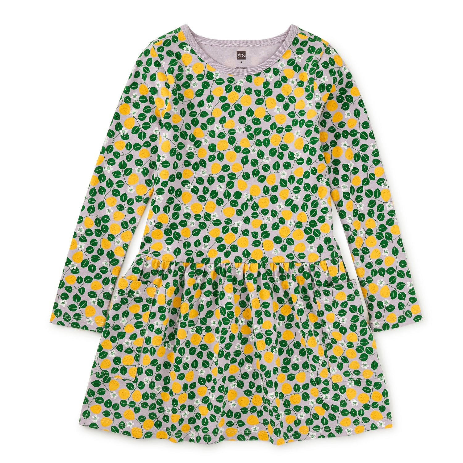 Green and yellow patterned dress on a white background
