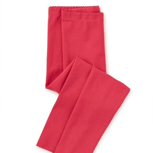 Red pants folded on a white background