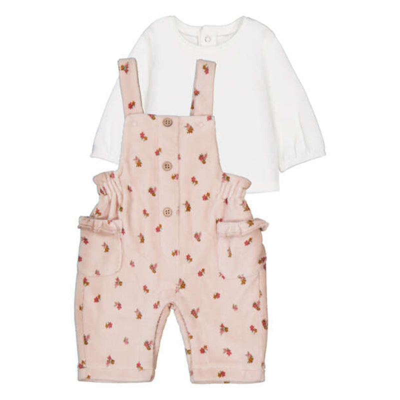 Baby outfit with pink floral overalls and white shirt on a white background