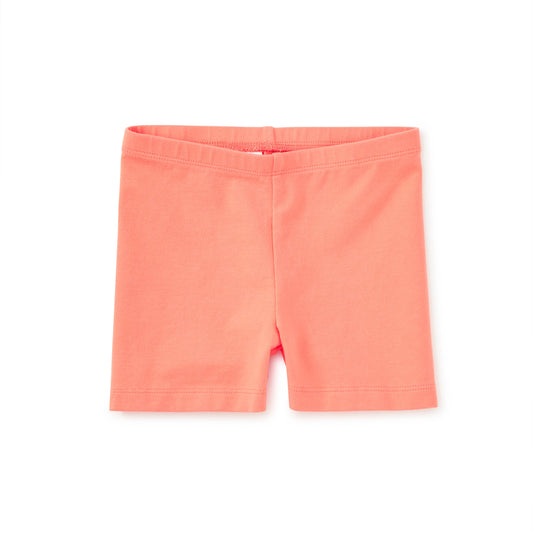 Coral shorts on a white background