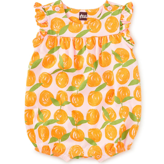 Baby romper with orange and green leaf pattern on a white background