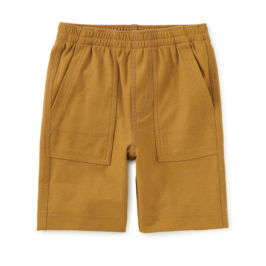 Mustard yellow shorts with an elastic waistband on a white background