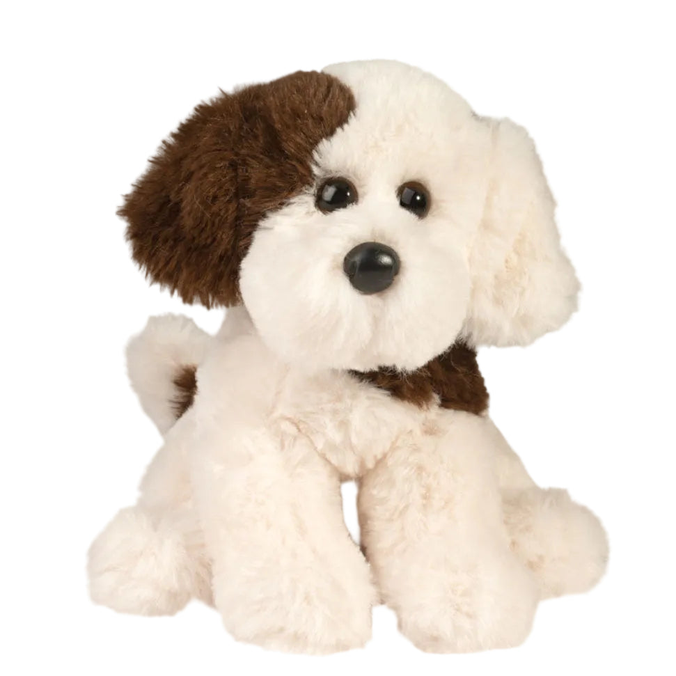 Plush toy dog with brown and white fur on a white background