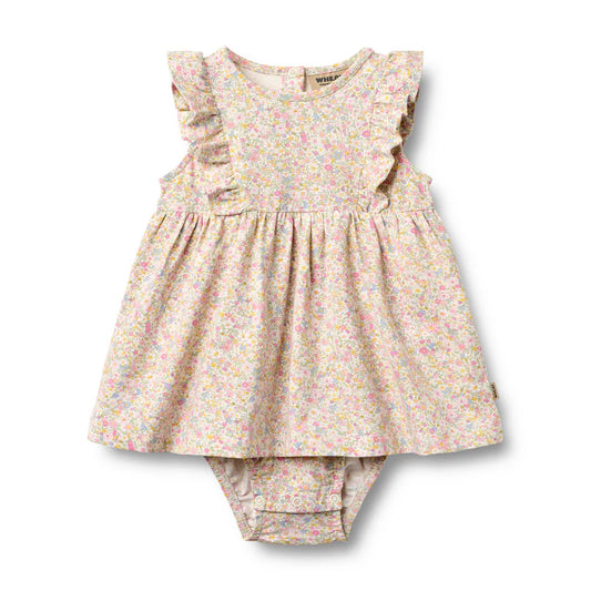 Floral baby dress and bloomers set on a white background