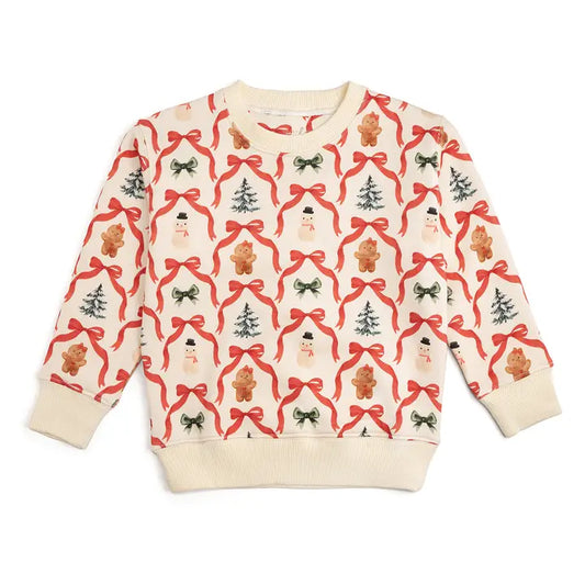 Christmas-themed sweater with ribbons, trees, and gingerbread men on a white background