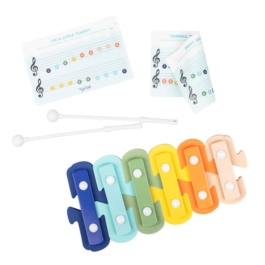 Set of colorful xylophone clips with music theory flashcards on a white background