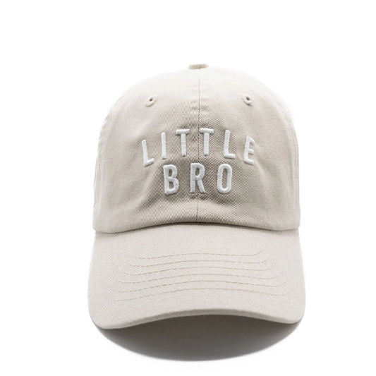 A beige hat with 'LITTLE BRO' written in white letters on the front.