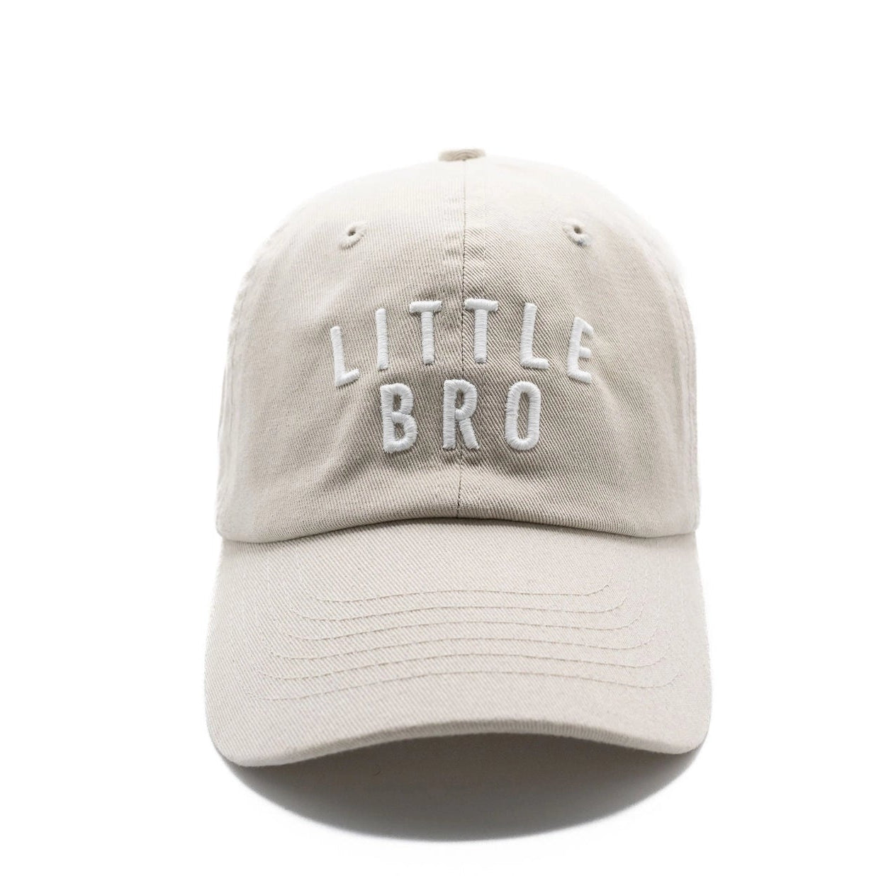 A beige hat with 'LITTLE BRO' written in white letters on the front.