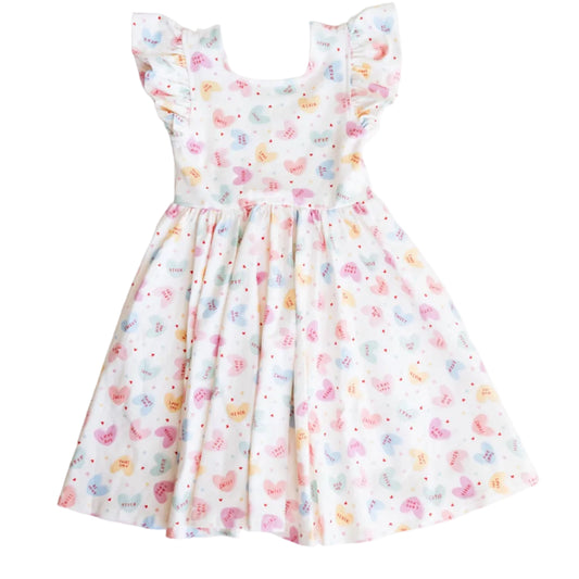 Children's dress with colorful floral pattern on a white background