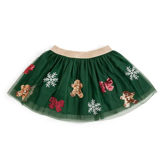 Green tutu skirt with gingerbread men and snowflakes on a white background