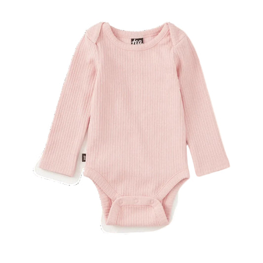 A light pink ribbed long-sleeve baby bodysuit with snap closures at the crotch, laid flat on a white background.