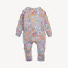 A baby long-sleeve one-piece romper with an all-over colorful floral and butterfly pattern on a light pink base.
