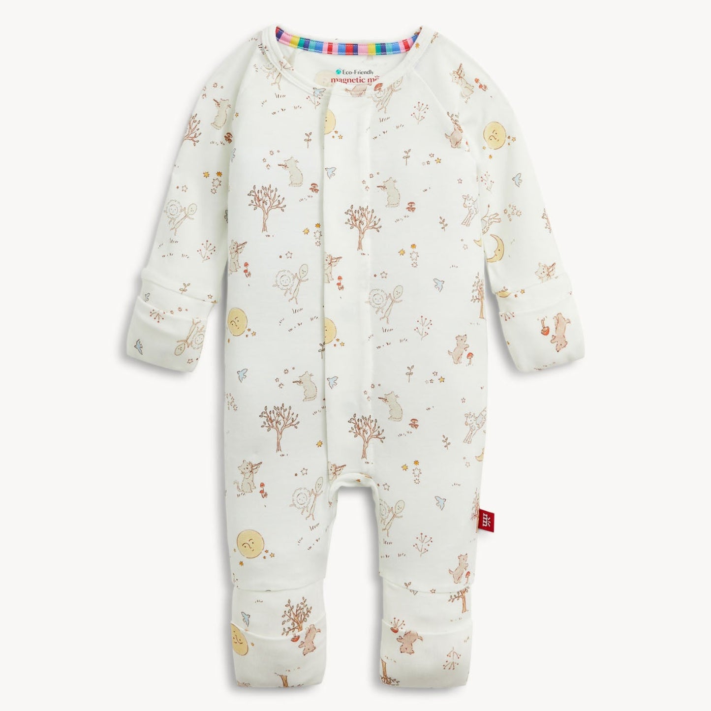 A baby long-sleeve footless one-piece romper in off-white, decorated with a whimsical woodland print of trees, birds, flowers, and stars. The romper features a colorful striped inner collar and a small red tag on the lower leg, shown against a plain light background.