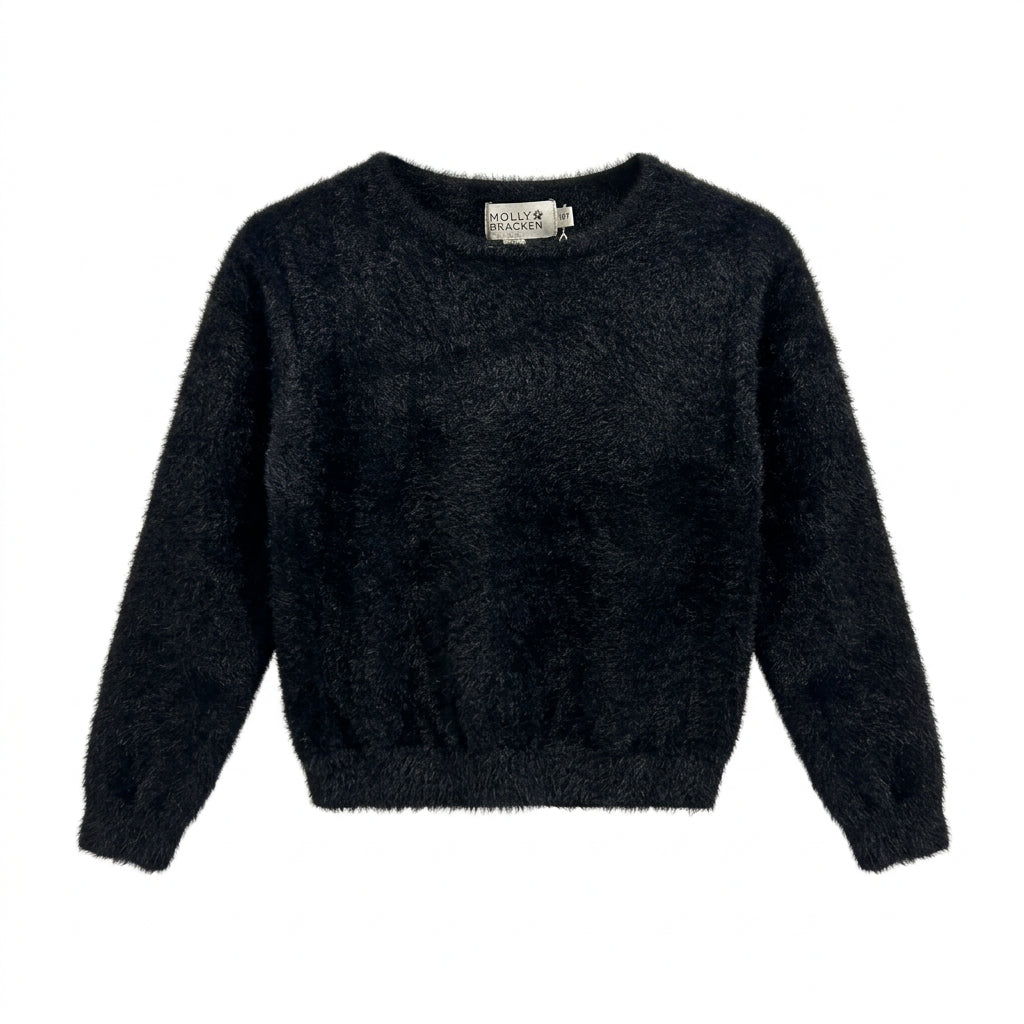 A black fuzzy long-sleeve cropped sweater hanging on a white hanger against a white wall.