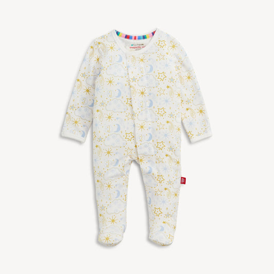 A baby long-sleeve footed sleeper in blue and white with a gold star and moon pattern.