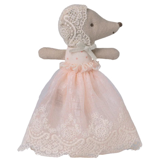 Toy mouse in a lace dress and bonnet on a white background