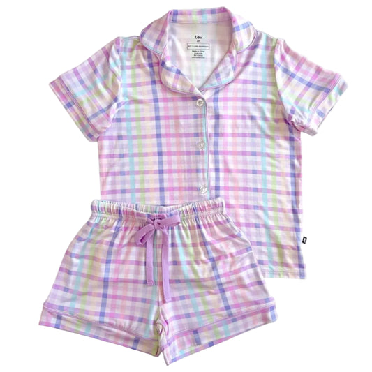 Pastel plaid children's pajama set on a white background