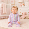 Baby in a pastel colored plaid footie romper
