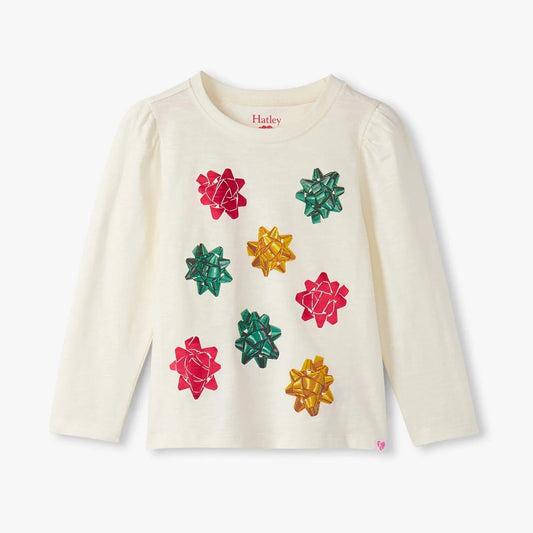 White long-sleeve shirt with colorful flower patterns on a white background