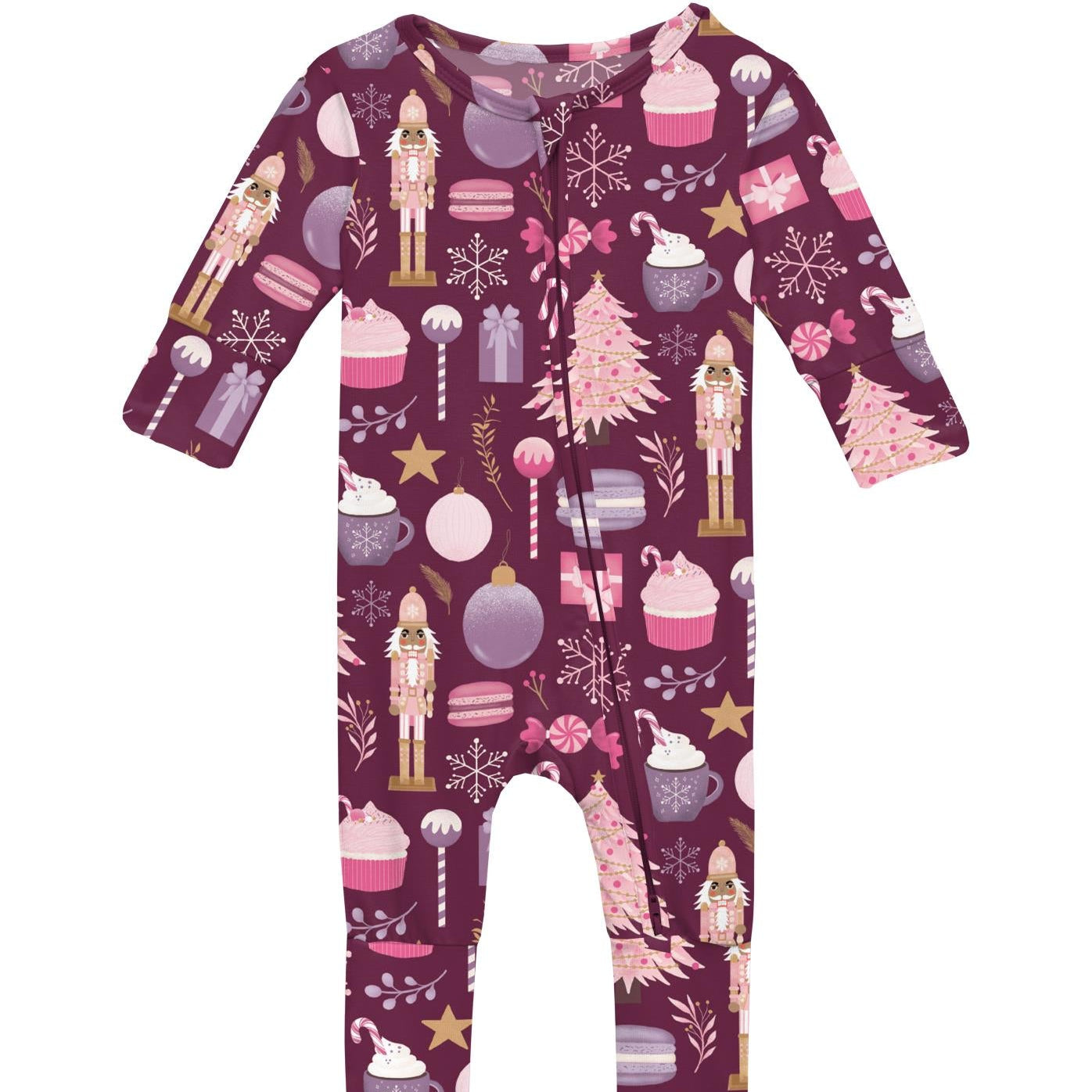 A festive purple baby romper with flip paws and footies, featuring holiday-themed prints such as a nutcracker, candy cane, and snowflakes.