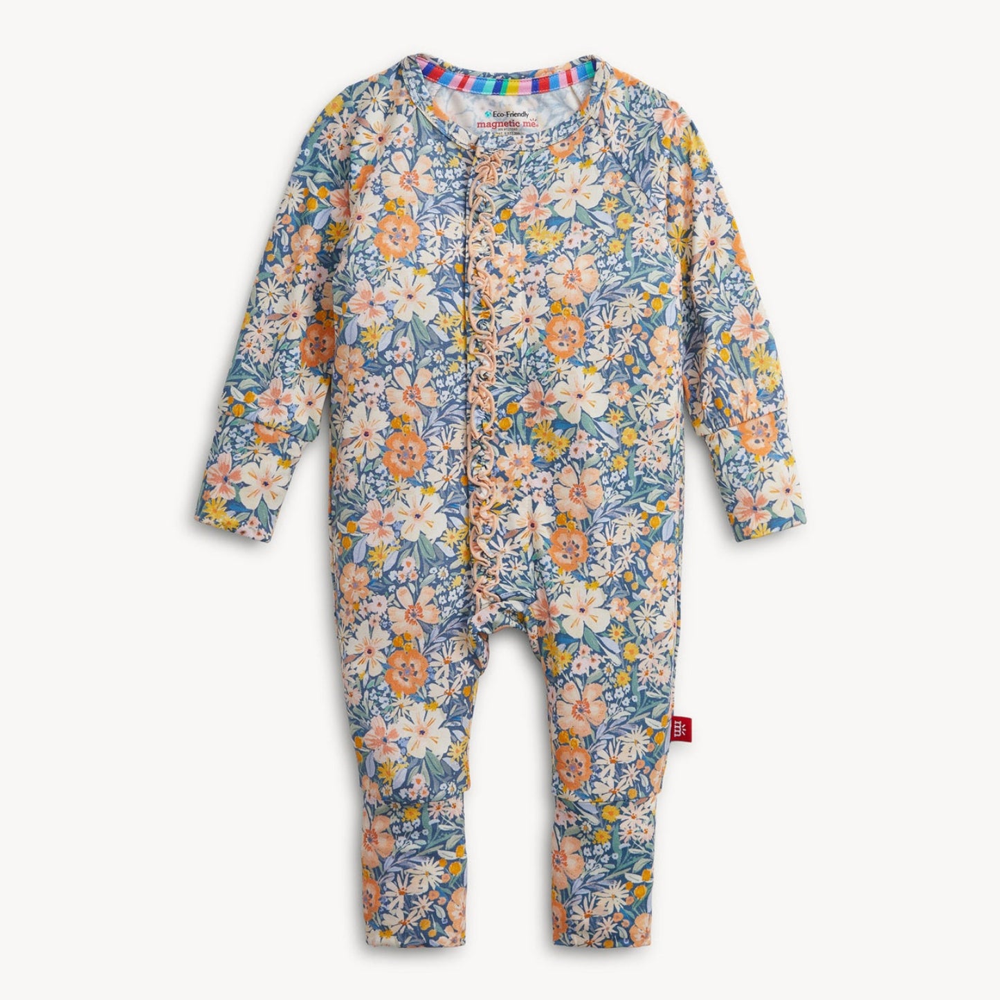 A baby long-sleeve footless one-piece romper with an all-over floral print in blue, pink, orange, and cream, featuring a snap-button front closure and a small red tag on the leg.