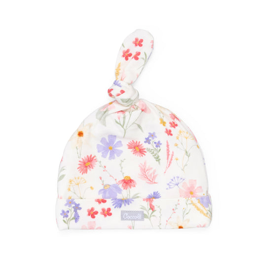 Floral-patterned baby hat on a white background