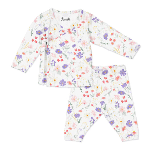 Children's floral pajama set with long-sleeve top and pants on a white background