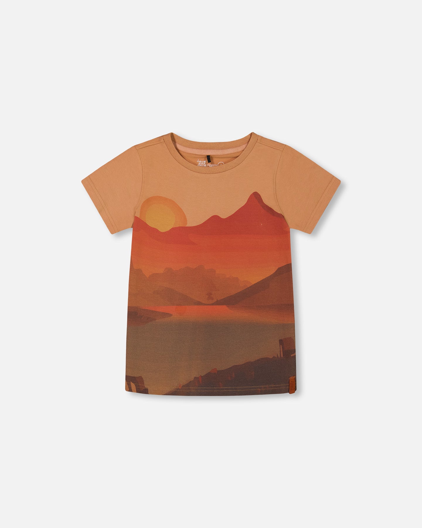 A beige t-shirt with a printed graphic of mountains and a sunset.