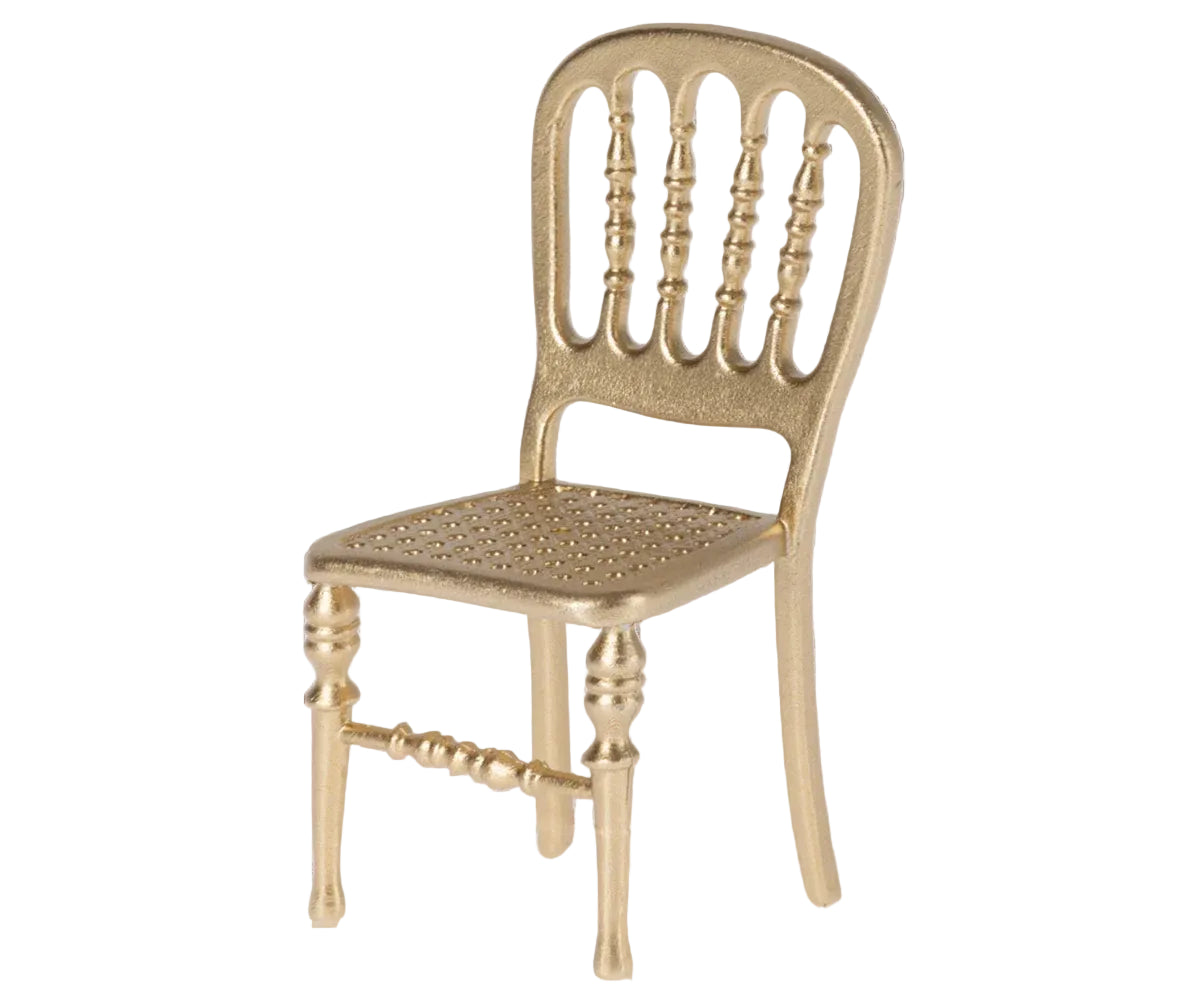 Gold metal chair with a white background