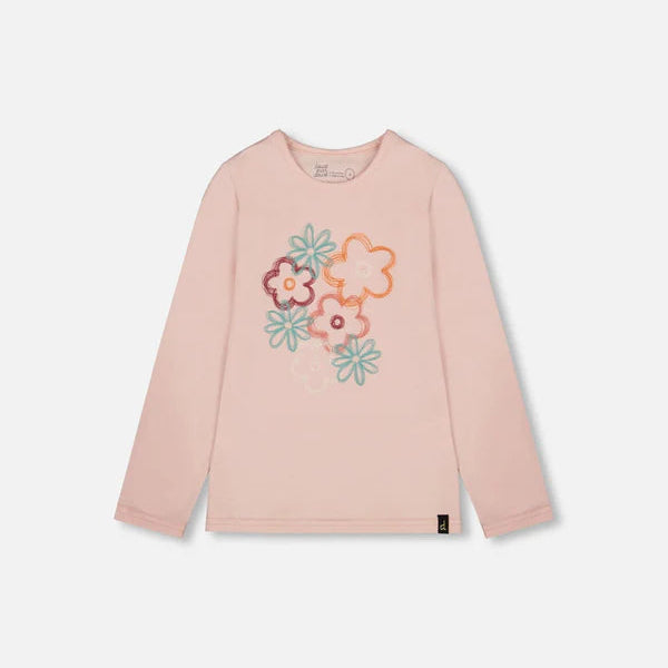 Pink long-sleeve shirt with colorful floral design on a light gray background