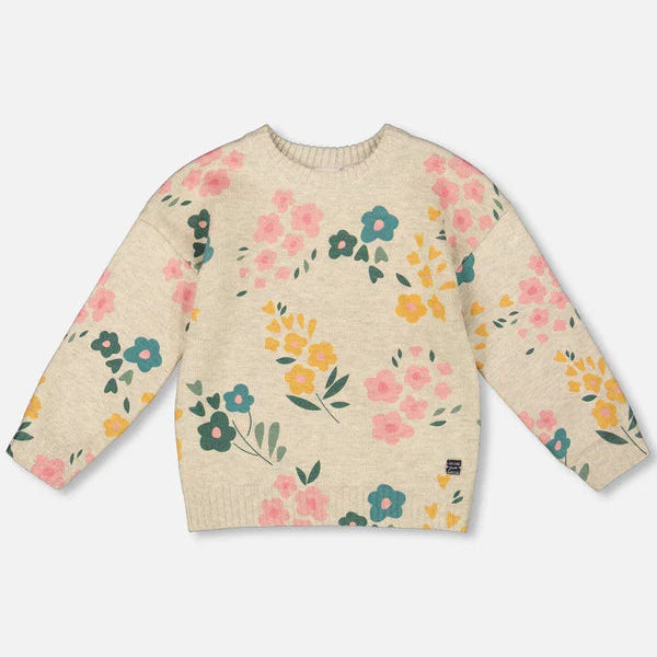 Floral patterned sweater on a light beige background