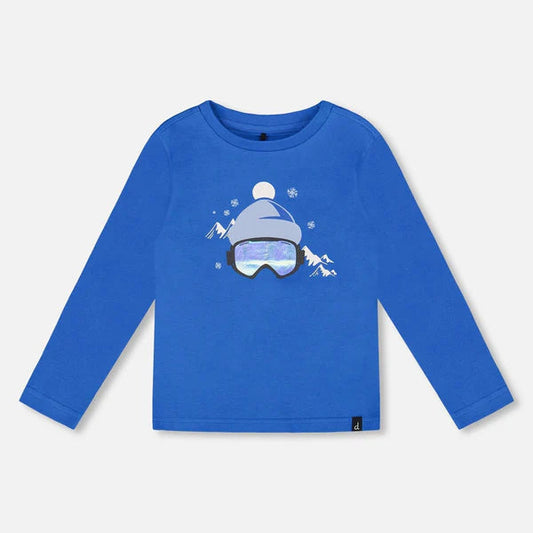 Blue long-sleeve shirt with a graphic design on a white background