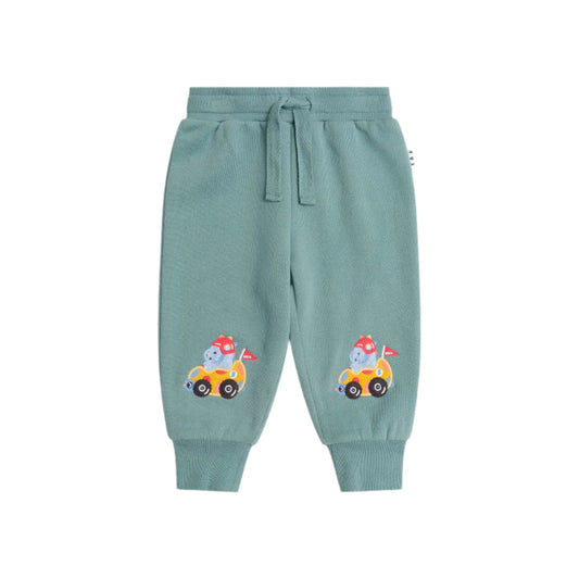 Light blue sweatpants with cartoon character on a beige background