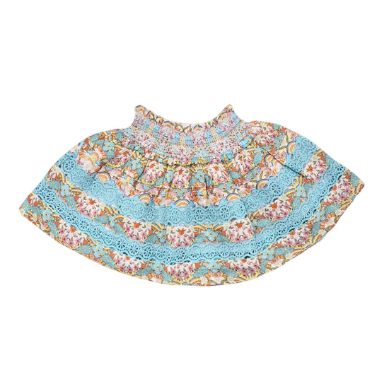 Floral dress with blue trim on a white background